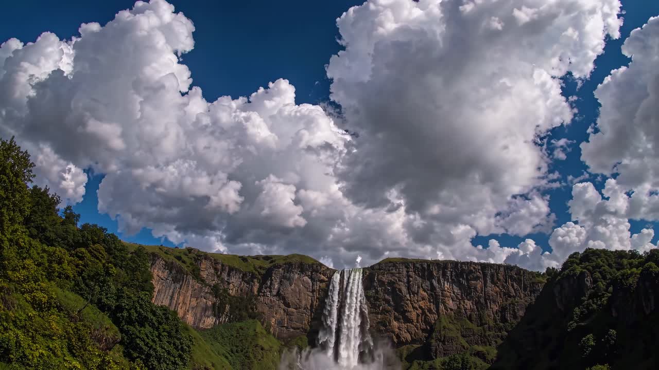 Majestic waterfall under cloudy sky