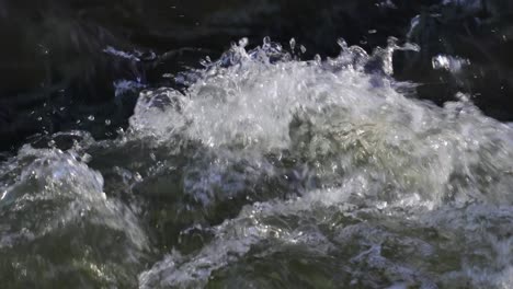 close-up of wild foaming and rolling water