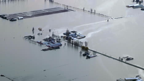 aerial shot of flooded farms after major storms hit british columbia