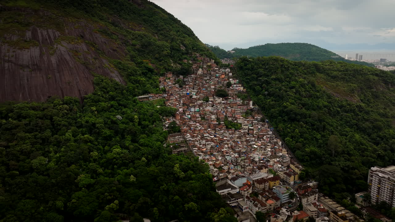 Congested built-up favela neighborhood in Rio de Janeiro, aerial pullback view