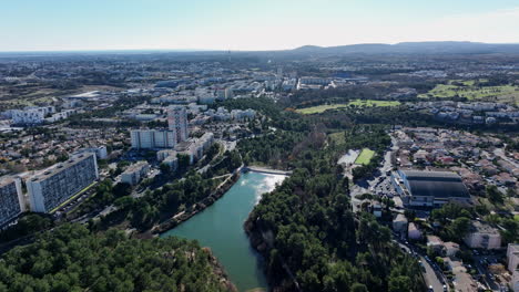 aerial: la mosson's dam stands tall amid urban evolution.