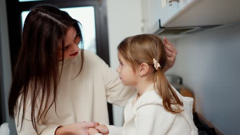 loving worried mom embrace upset little daughter