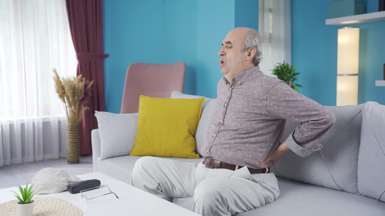 Old man suffering from back pain.