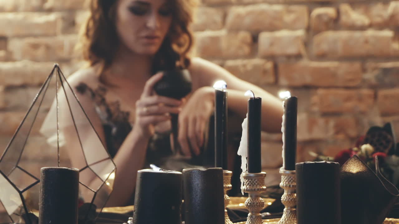 Woman with candles divination magic. Witch woman with candle looking into the future