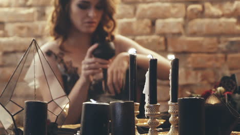 woman with candles divination magic. witch woman with candle looking into the future