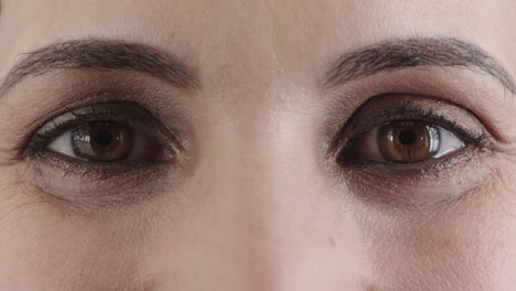 close up caucasian woman brown eyes opening happy expression wearing makeup looking mascara cosmetics optical health