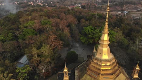 Flying-over-the-famous-golden-Wat-Pa-Phon-Phao-temple-at-Luang-prabang,-aerial