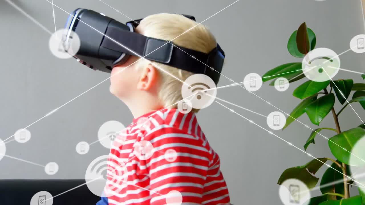 red de iconos digitales contra un niño caucásico que usa auriculares vr en casa