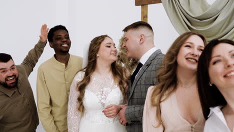 wedding couple and friends at the altar