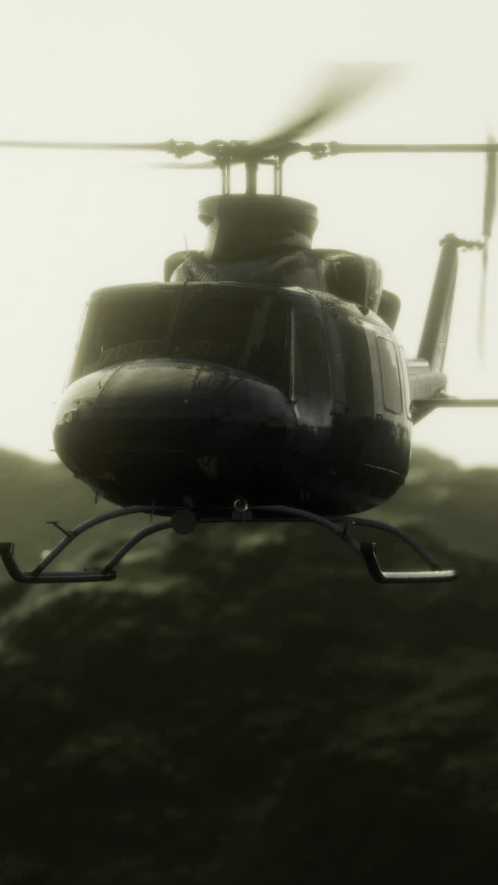 Helicopter soaring above rugged mountains in muted light at dusk