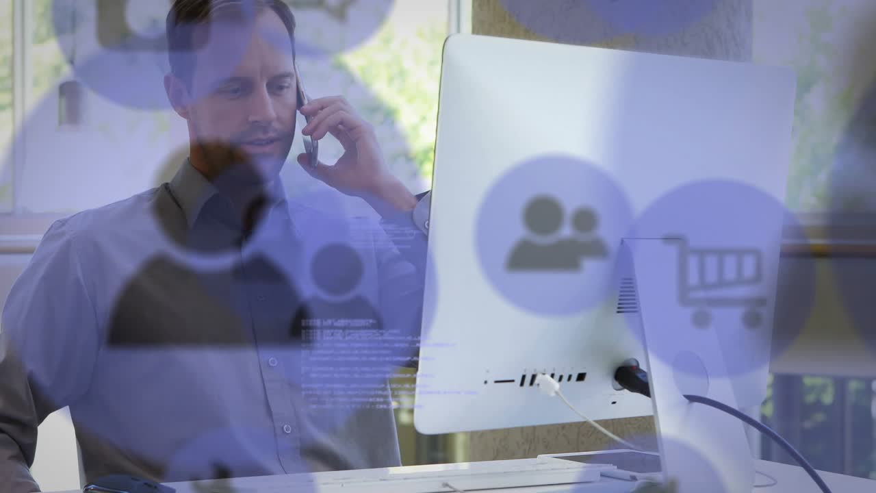 Worker pausing typing, reaching phone and calling while cart icons overlaying screen for business