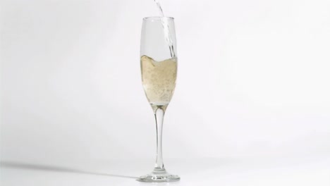 Animation-of-burning-layer-over-glass-of-champagne-on-white-background