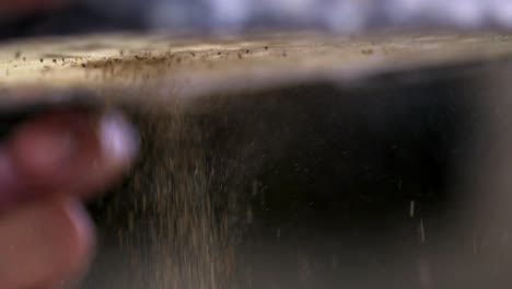 macro shot of manufacturing process of madder powder, made from natural plant roots