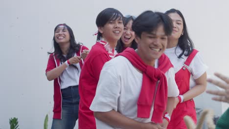 young asian people win the tug of war competition called lomba tarik tambang on indonesian independence day