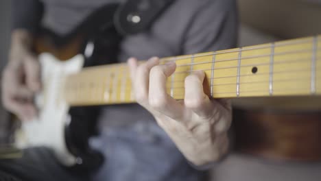 a man playing rock song on an electric guitar