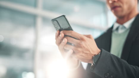 businessman using a smartphone in an office