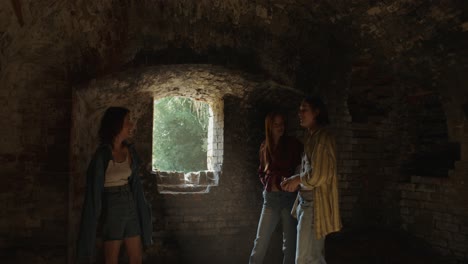 friends talking in an old ruin