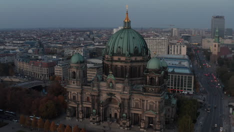 Slide-and-pan-footage-of-Berliner-Dom.-Famous-church-and-city-at-dusk-in-background.-Berlin,-Germany