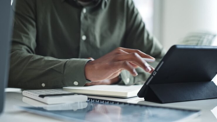 Tablet, hands and accountant bookkeeping