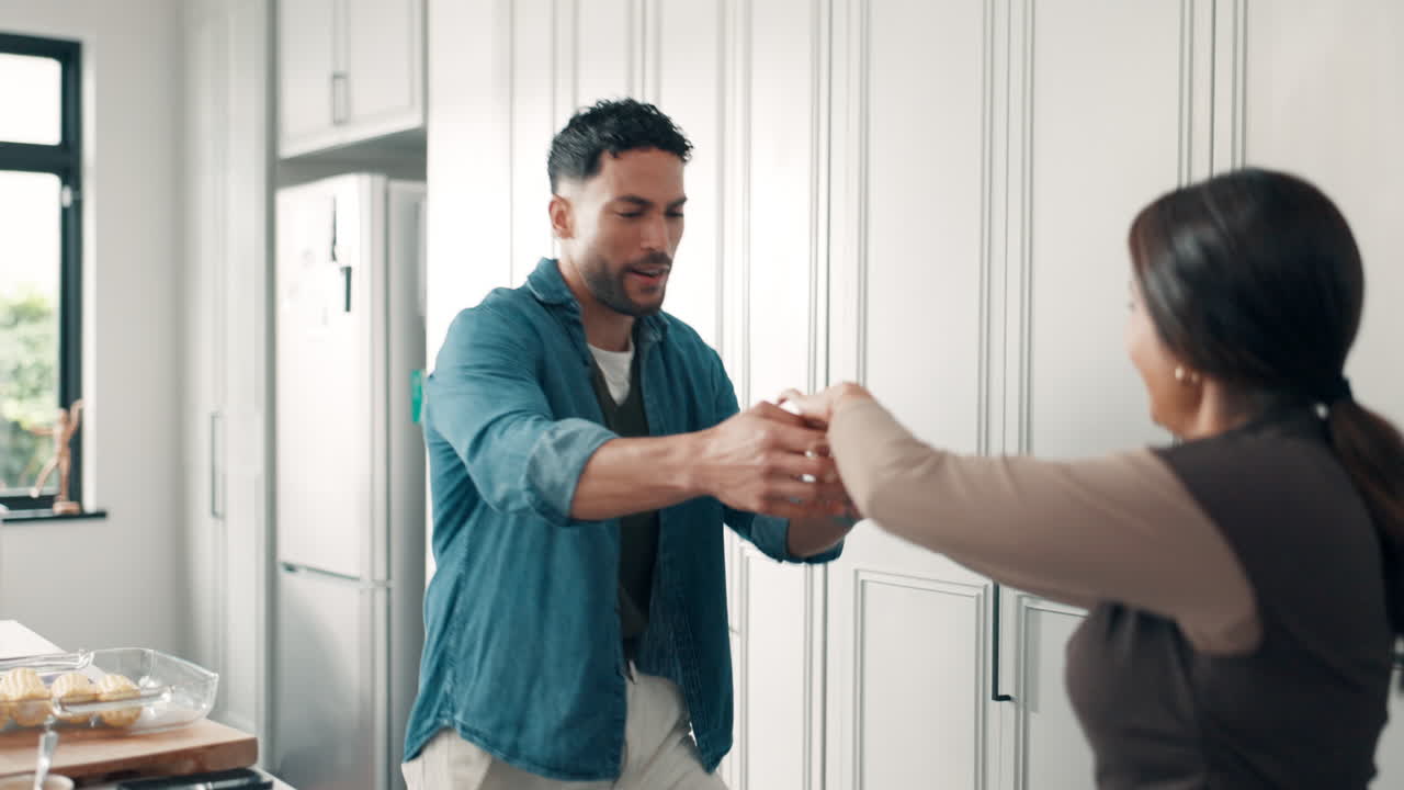 Family Dancing in Kitchen