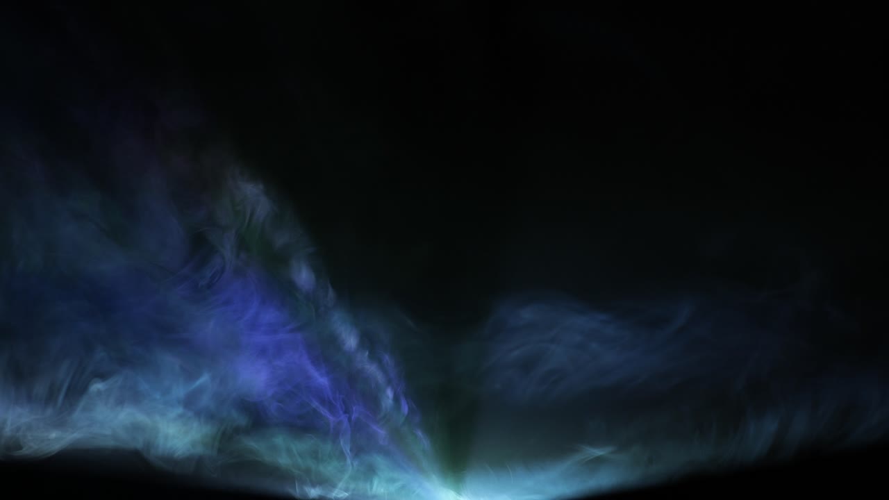 Video projector beam shining through smoke with jib moves