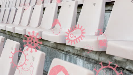 iconos del concepto de coronavirus contra asientos vacíos en un estadio deportivo