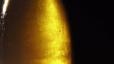 bottle with a cold drink thin layer of ice on the glass surface