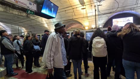 people gathered in rome metro station