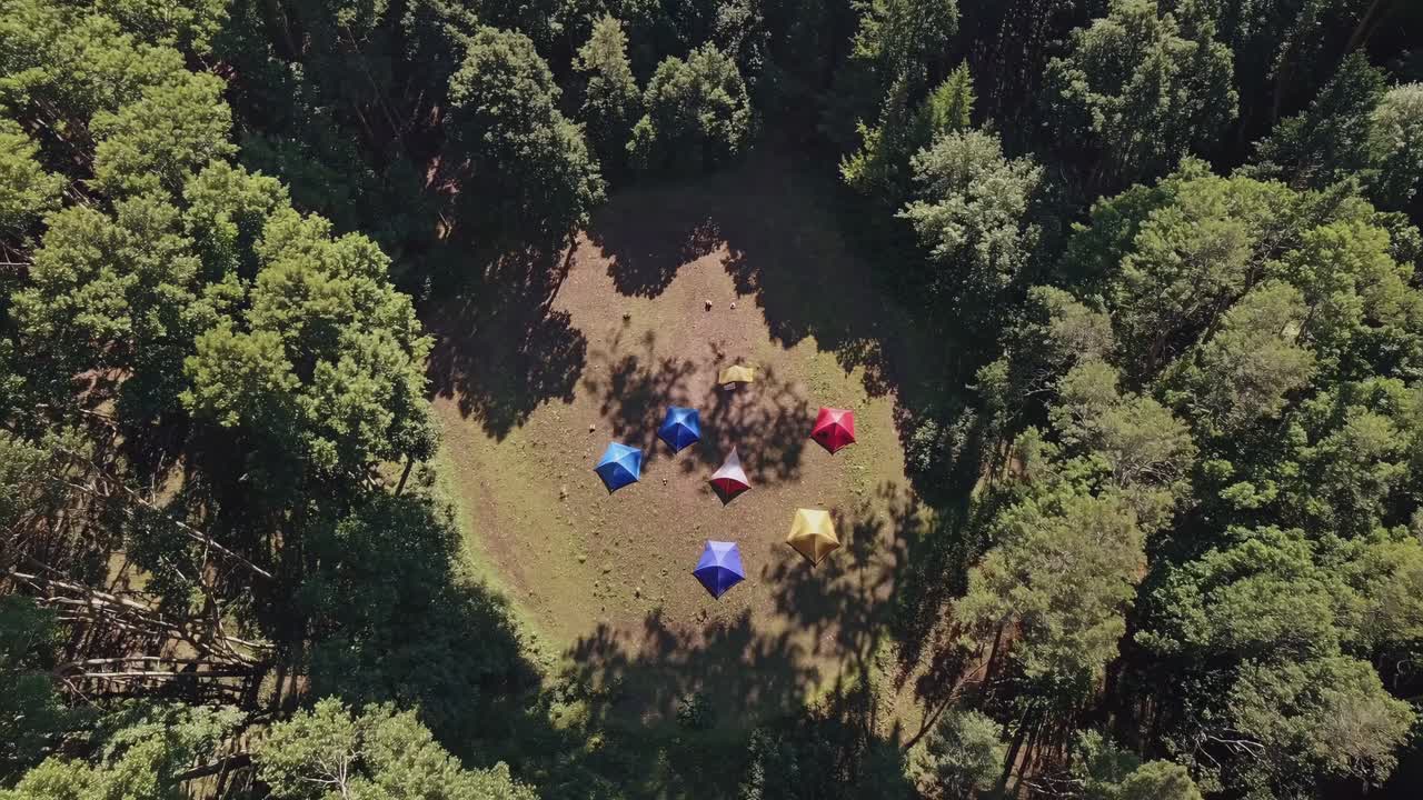 Aerial View of Colorful Tents in a Forest Campsite