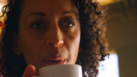 female executive having coffee in cafeteria 4k