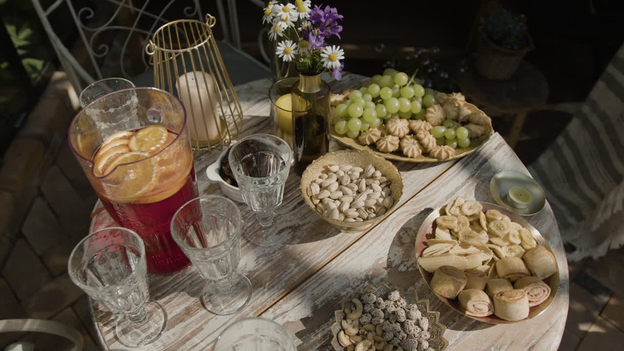 Outdoor table with an assortment of snacks and drinks