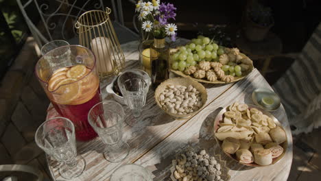 outdoor table with an assortment of snacks and drinks