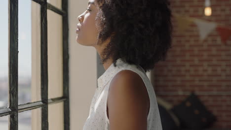 happy young woman using smartphone at home browsing social media messages enjoying relaxed morning looking out window
