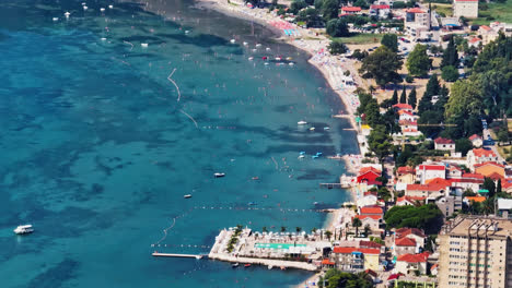 telephoto drone shot of the riviera of the podgora town in makarska, croatia