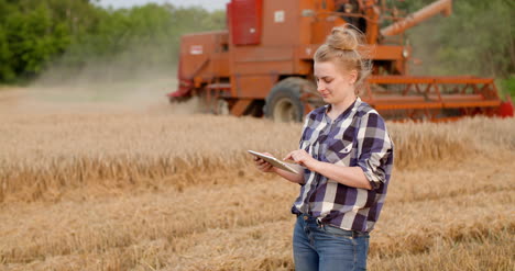 agriculture female farmer using digital tablet at harvesting 1