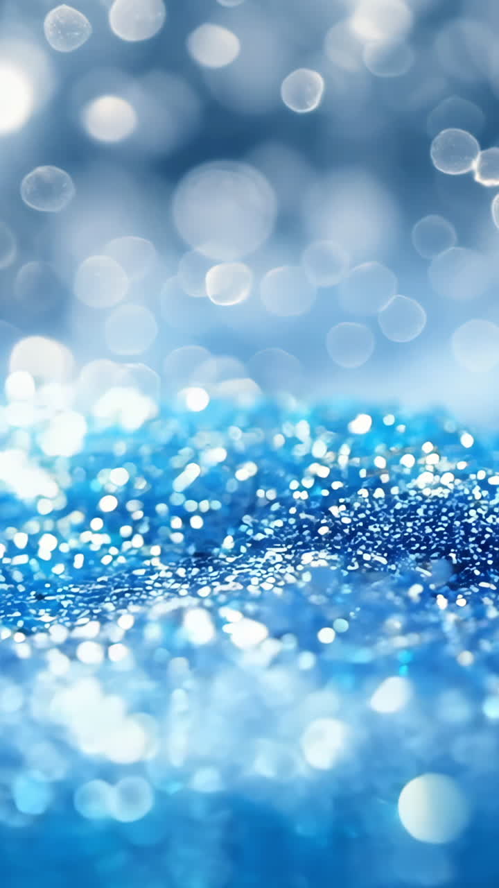 A snowy hill with a blue sky in the background. The snow is white and the hill is blue. The snowflakes are falling gently, creating a serene and peaceful atmosphere