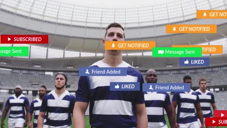 animation of media icons over diverse male rugby players at stadium