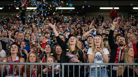 excitement and celebration among fans as they cheer at a lively sporting event with colorful confetti falling and joyful expressions on display