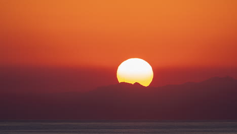 time-lapse of a warm and colorful sunrise