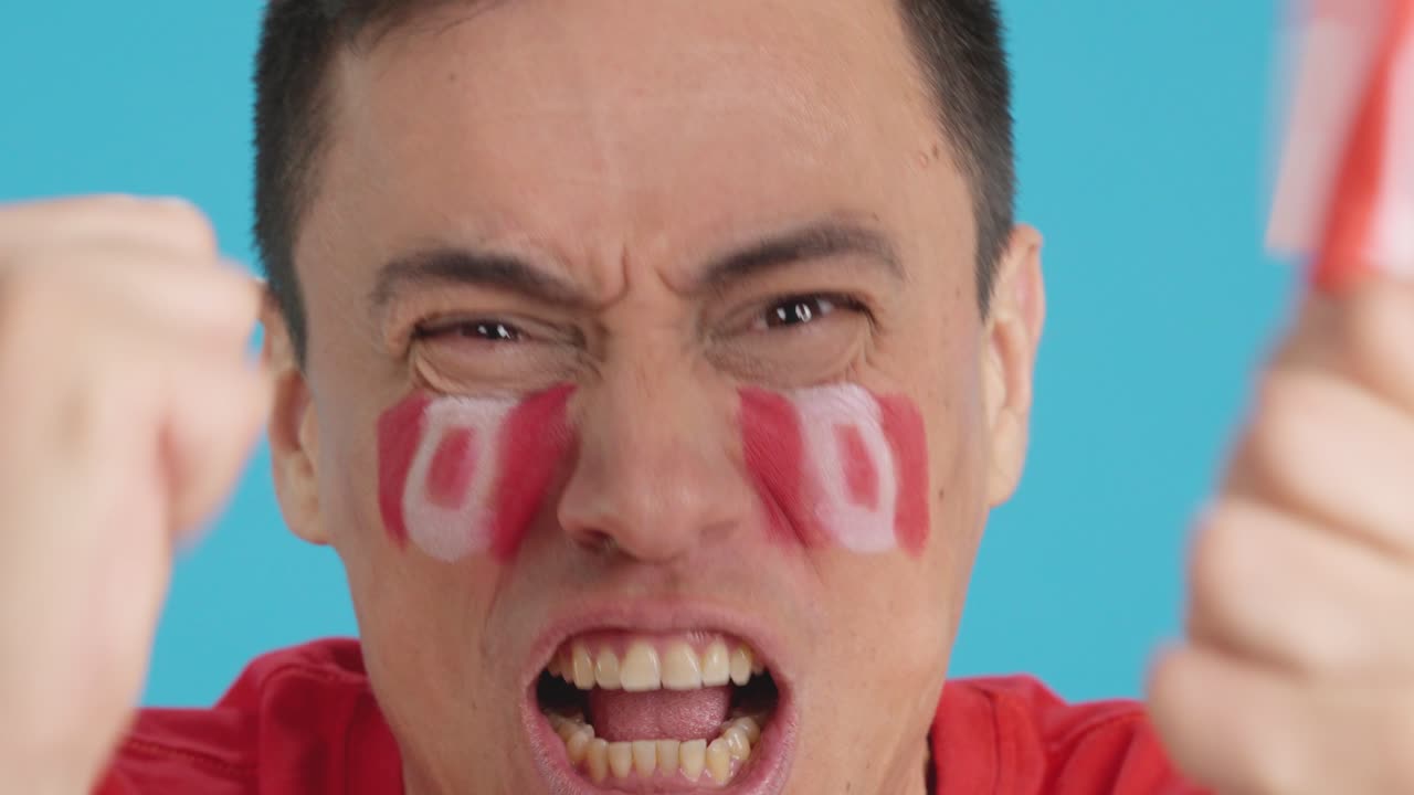 Close up of a man supporting canadian team