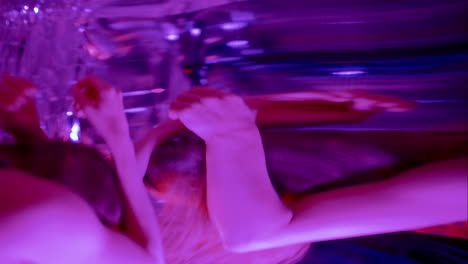 emotional dancer performing among distorted mirror reflections under neon light