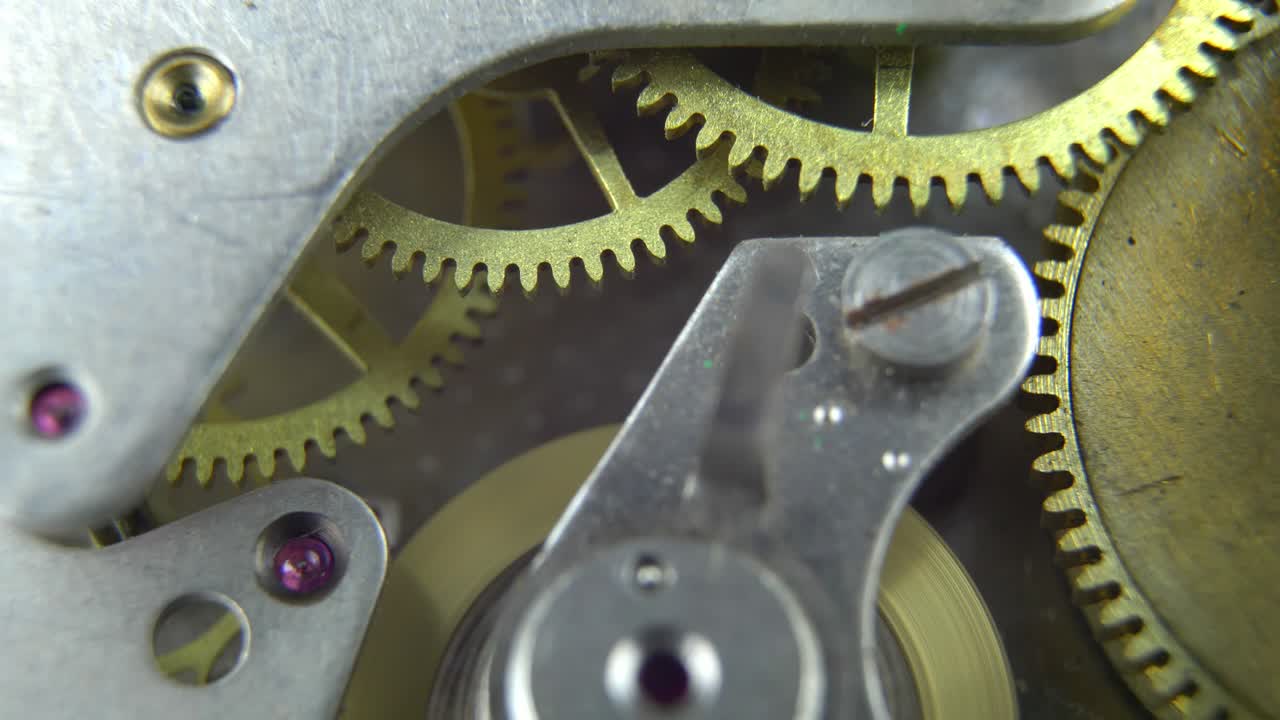 mecanismo de relojería de reloj retro ruedas dentadas giratorias engranajes tiempo de lapso cercano