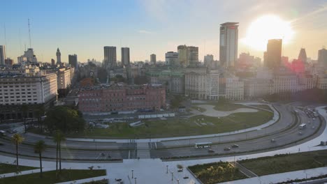 aerial pan of road traffic and buenos aires skyline from puerto madero