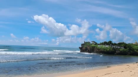 beautiful landscape footage of krakal beach in java island with clear sky and ocean waves