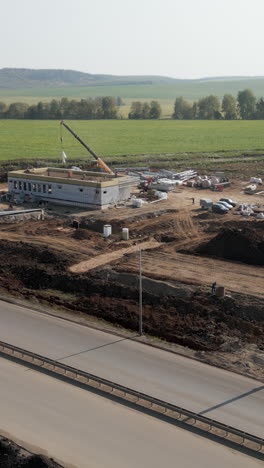 construction site with building under development and crane
