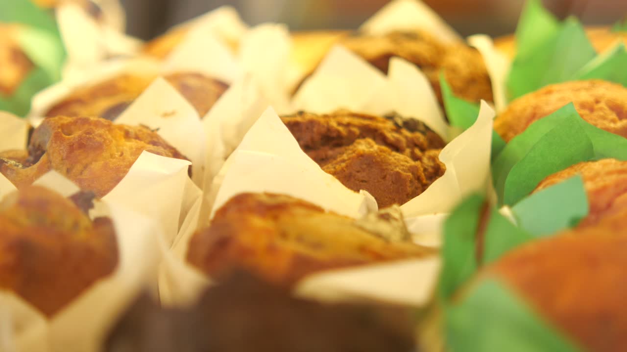 Close-up of assorted muffins and cupcakes in a bakery display