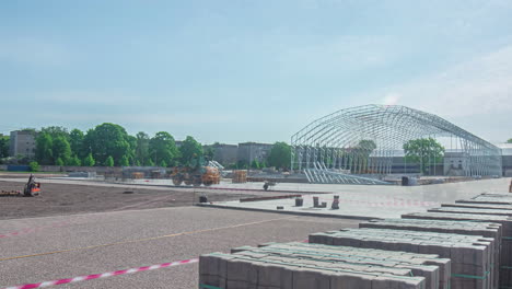 Time-lapse-shot-company-build-new-trade-hall-on-parking-field-during-sunny-day