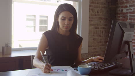 Businesswoman-Works-On-Computer-In-Office-Shot-On-R3D