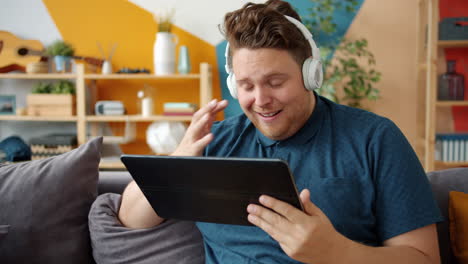 man watching video on tablet at home