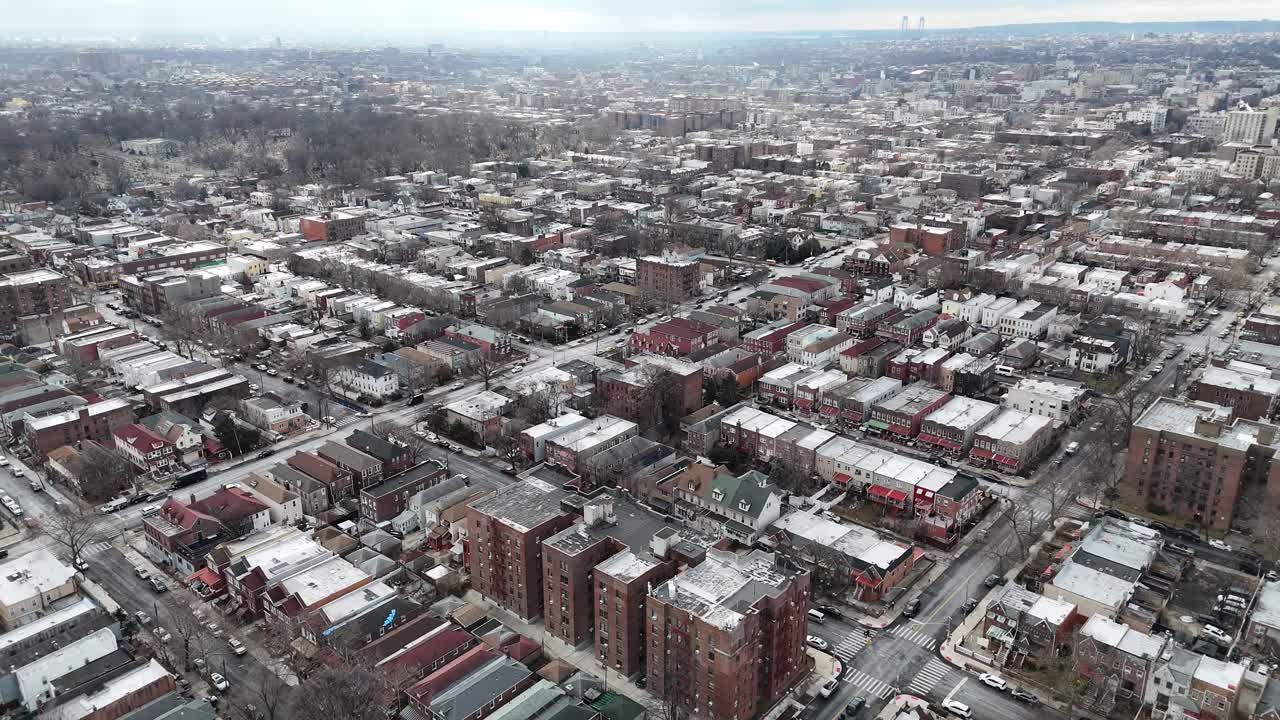 Horizontal drone circular tracking shot over Troy Ave, Brooklyn, capturing New York’s urban charm with scenic rooftops, residential areas, and dynamic cityscapes in stunning aerial detail.